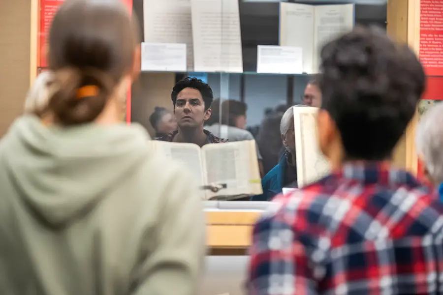 People looking at a special collections exhibition