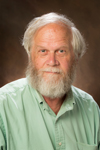 A headshot of Stan Brown crossed by a red background and the words Congratulations Stan Brown over the Miami University Libraries logo. 